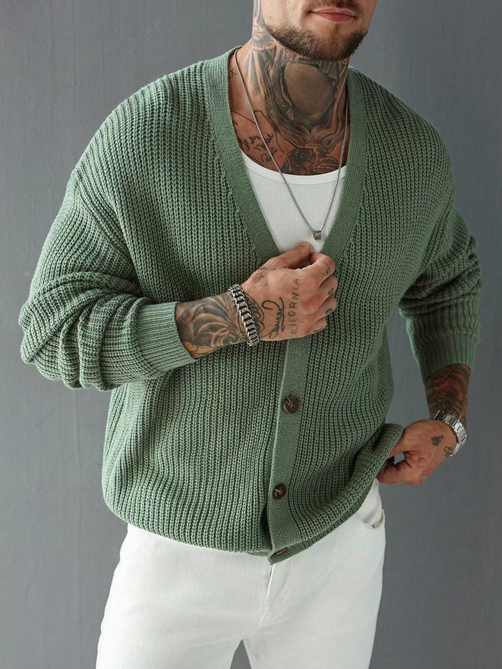 Close-up of the rib-knit texture on a men's V-neck cardigan