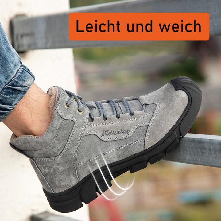 Side profile showing the sole of a grey safety shoe