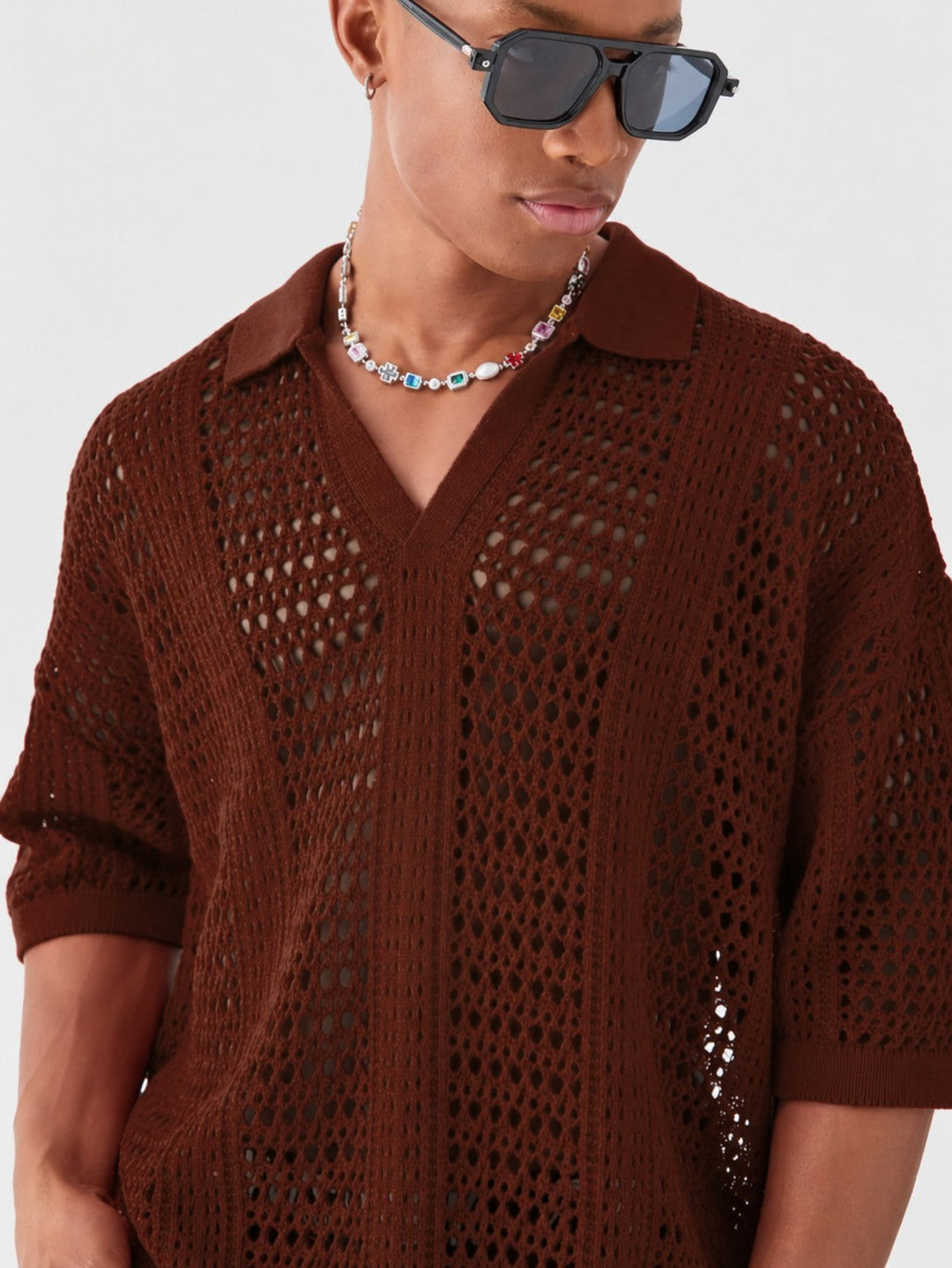 Full view of the men's lattice polo shirt showing its relaxed style