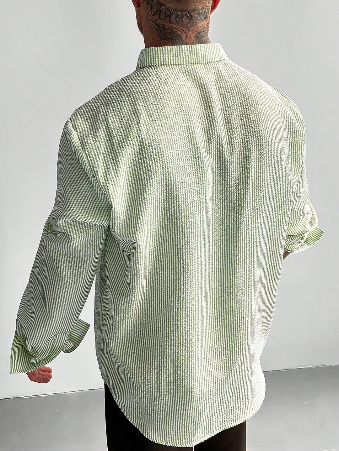 Men's striped seersucker shirt styled for casual summer wear
