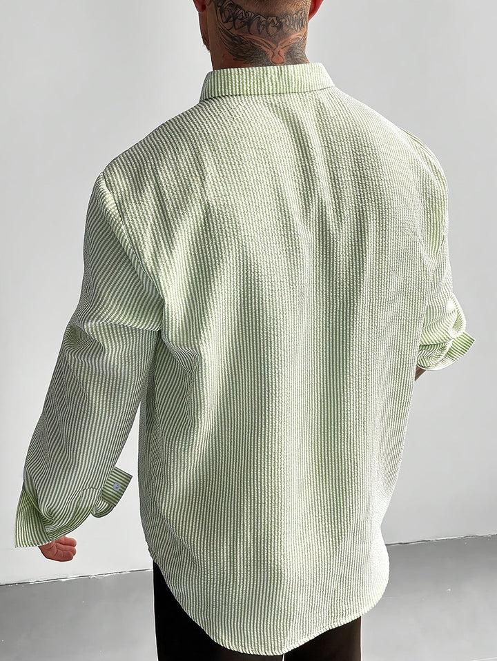 Men's striped seersucker shirt styled for casual summer wear