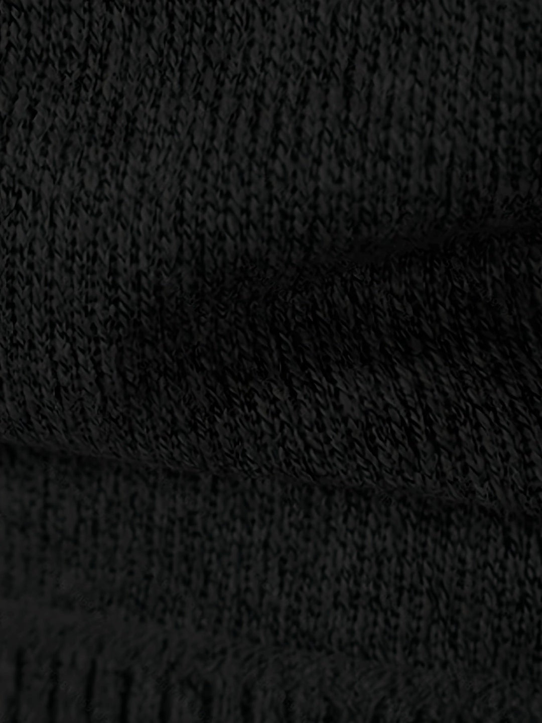 Front view of a men's textured knit cardigan with button fastening