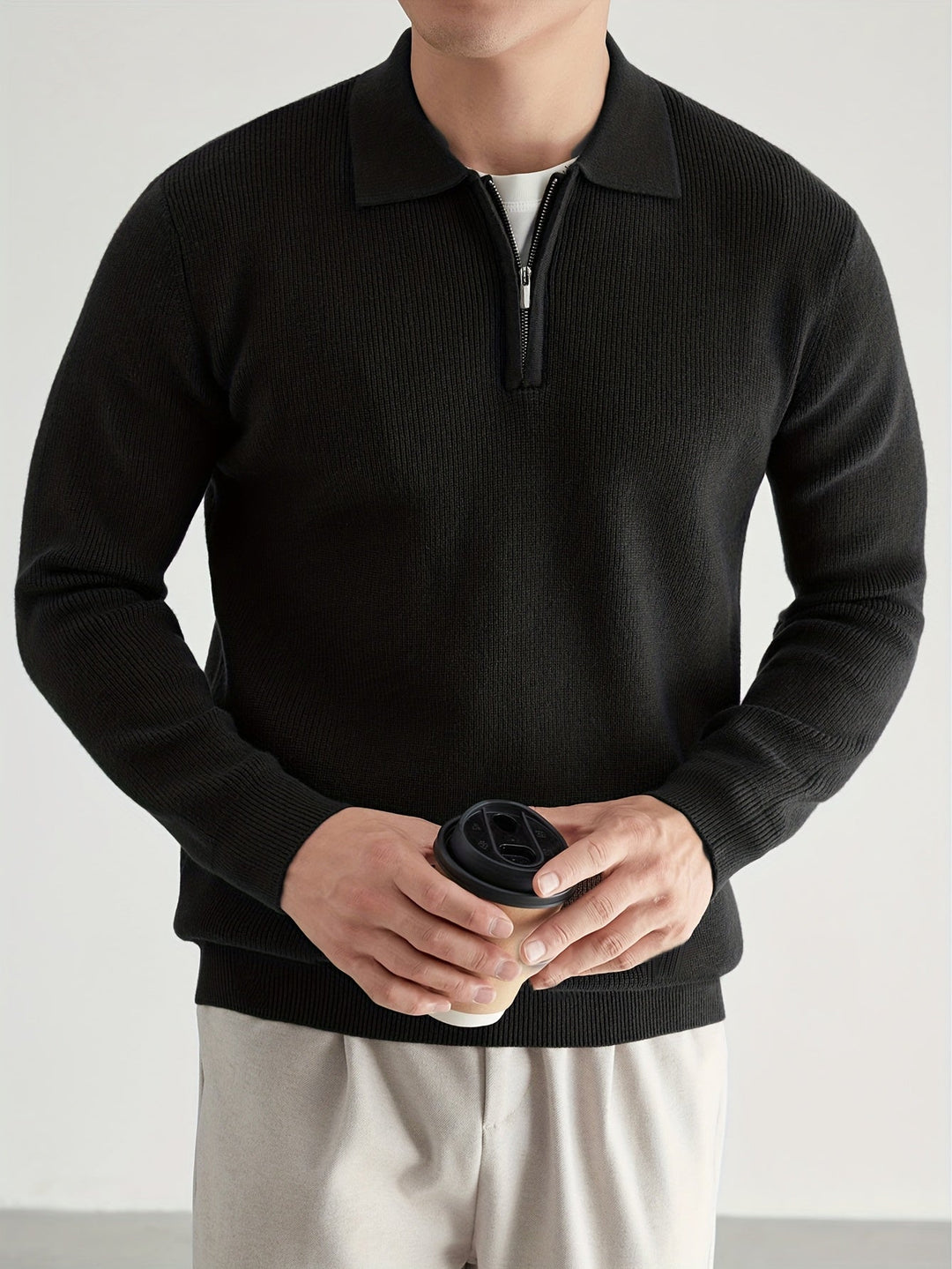 Men's jumper showing the polo collar and half zip fastening