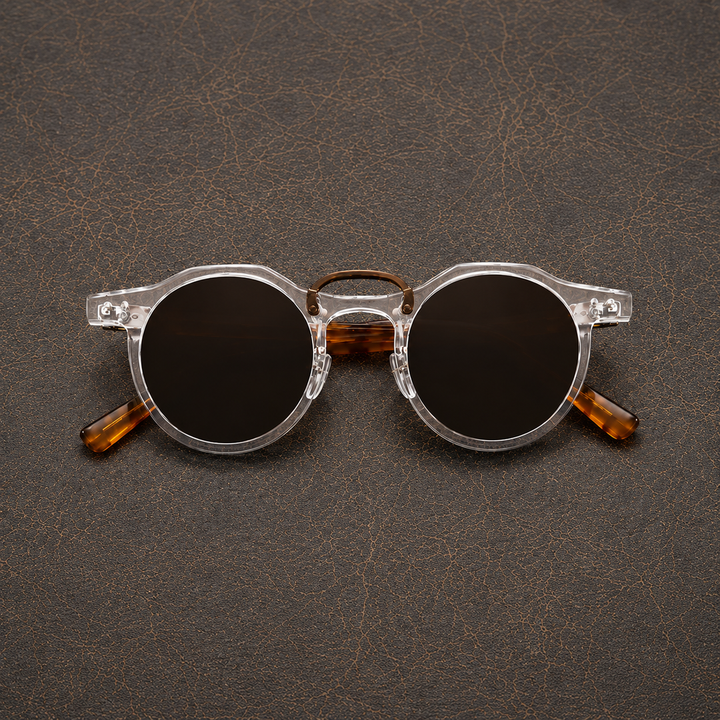 Close-up of men's round sunglasses showing round frames and tinted lenses