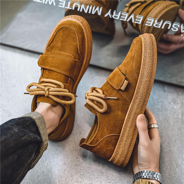 Pair of men's suede trainers with textured finish and chunky sole