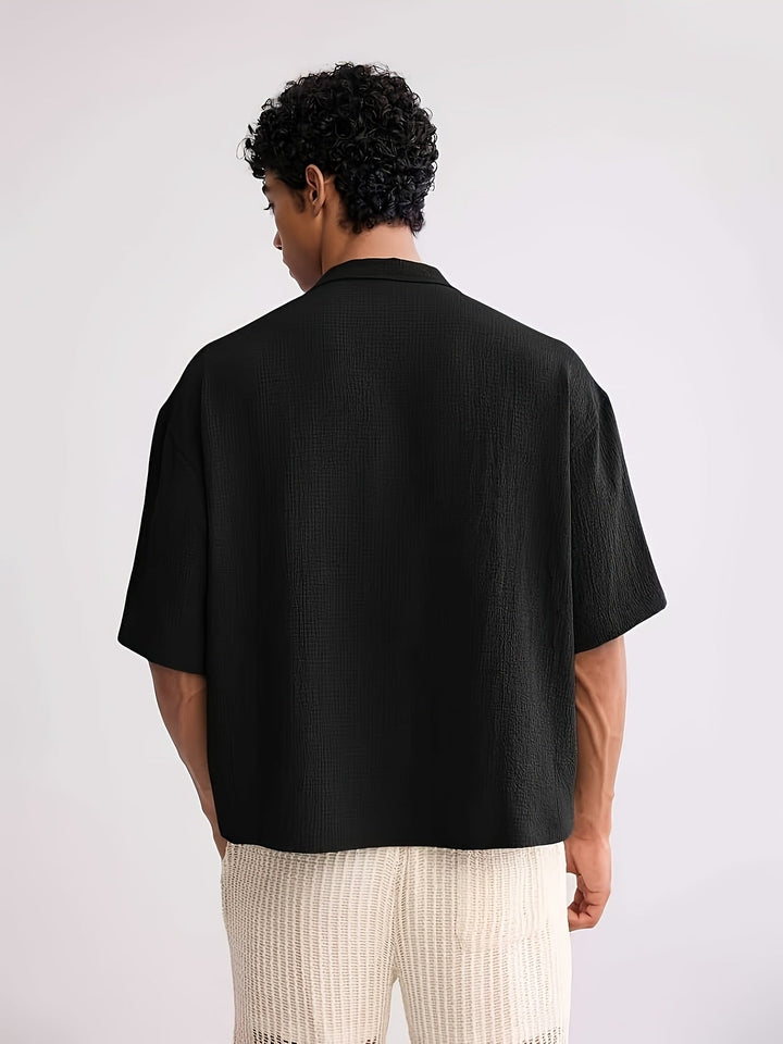 Close-up of the camp collar and front buttons on the men's shirt