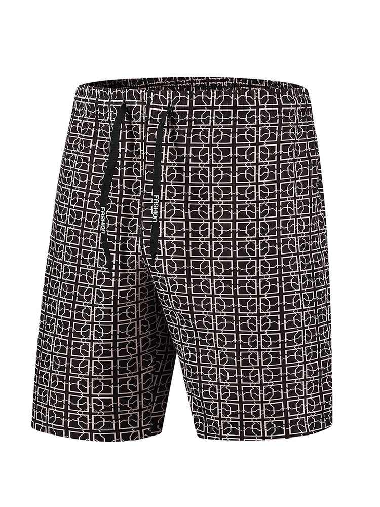 Men's cargo shorts with geometric print styled on a model, back angle