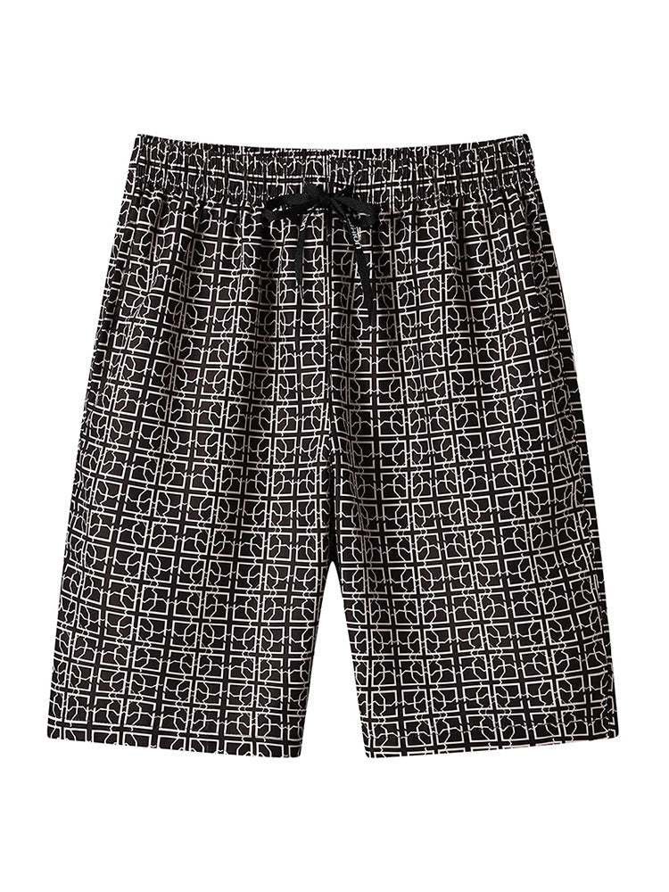 Close-up of waistband and fastening on men's geometric print cargo shorts