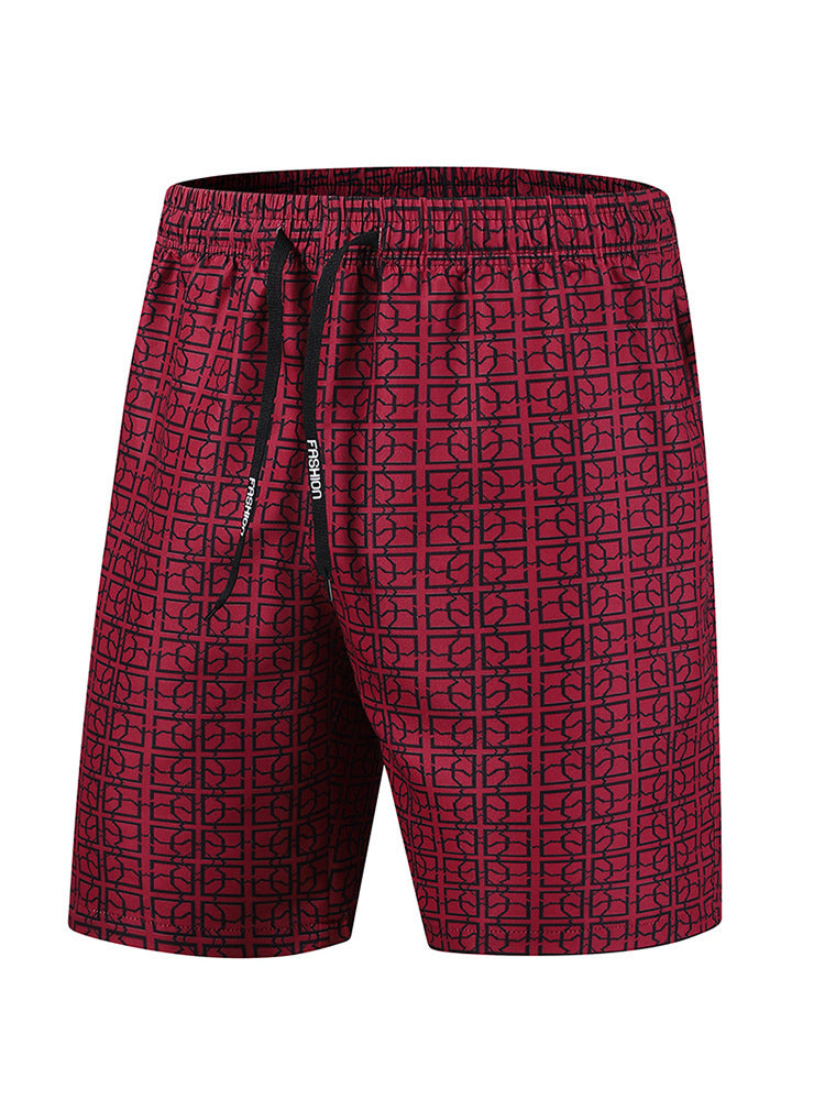Men's cargo shorts with geometric print styled on a model, front angle