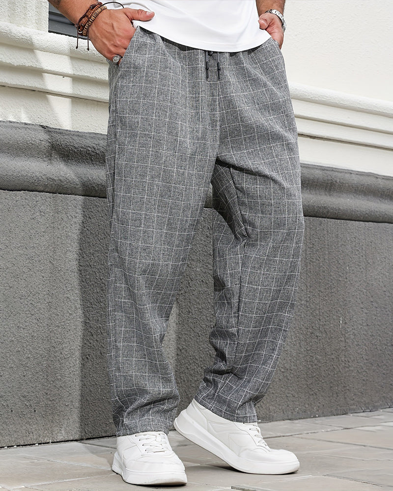 Men's straight leg plaid drawstring trousers shown from the front