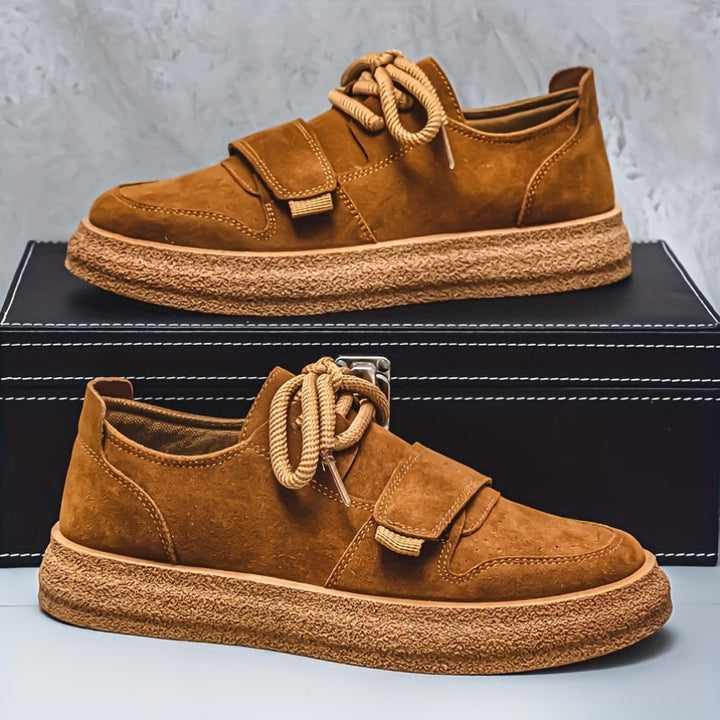 Men's suede trainers with chunky sole shown from the front angle