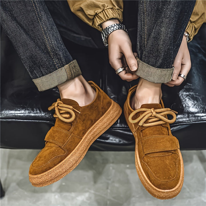 Top view of men's suede trainers showing lace-up detail