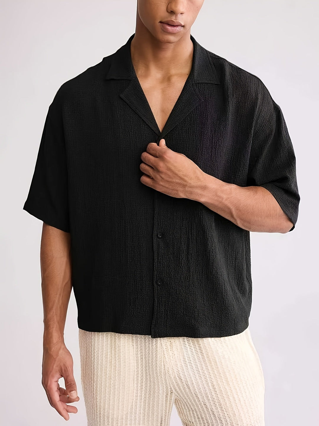 Side view of men's relaxed fit short-sleeve camp collar shirt