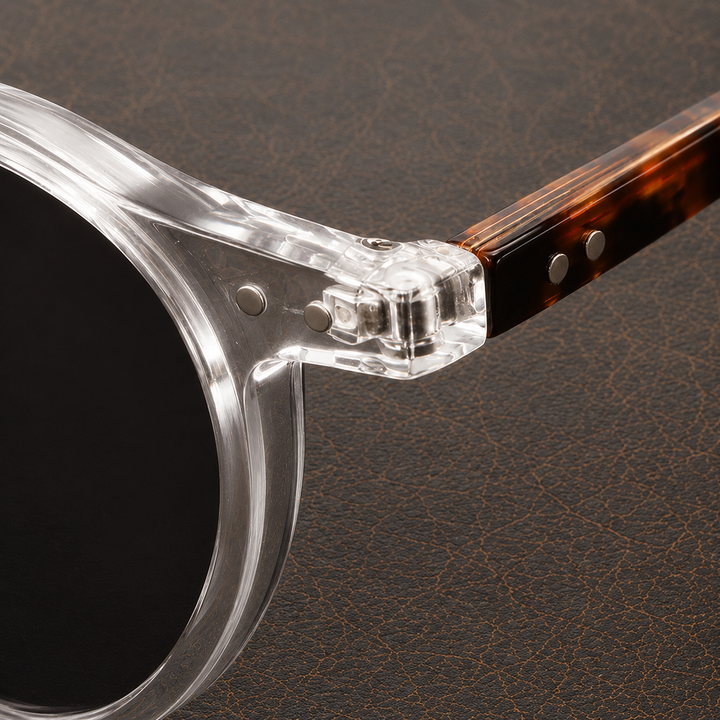 Folded men's round frame sunglasses with tinted lenses