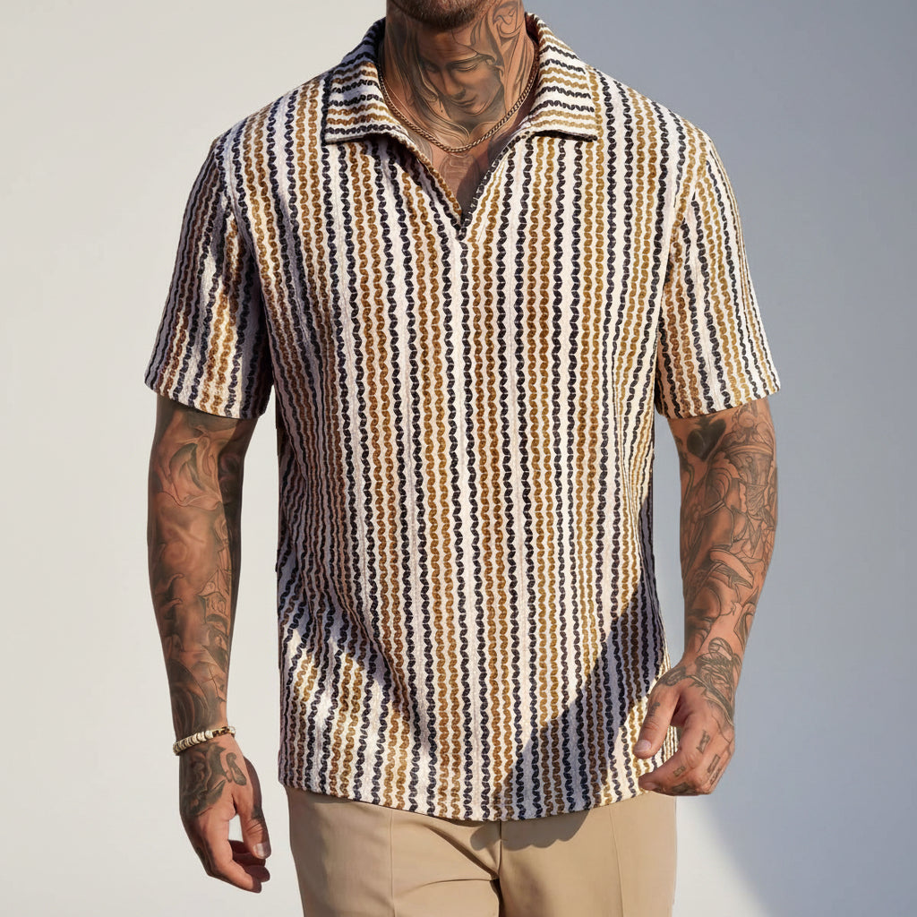 Close-up of the hem and fabric texture of the men's Aztec polo shirt