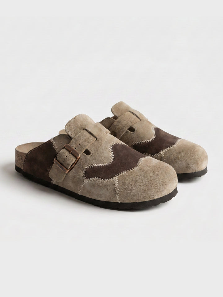 Men's beige suede clogs angled to show the sole and shape