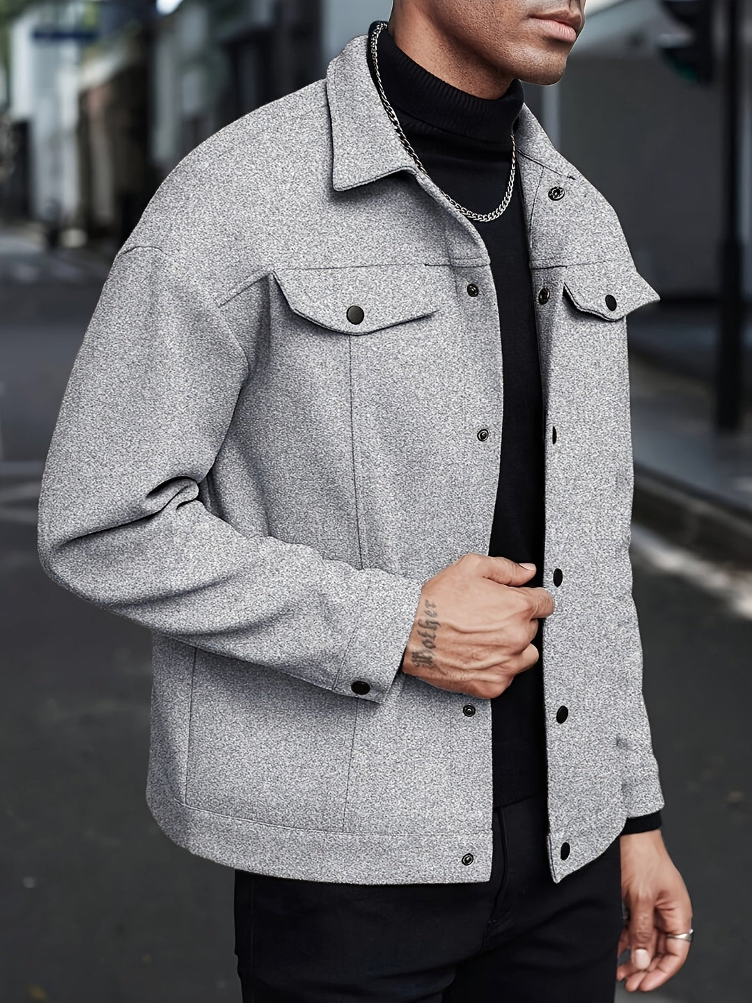 Men's jacket displayed in a clean studio setting