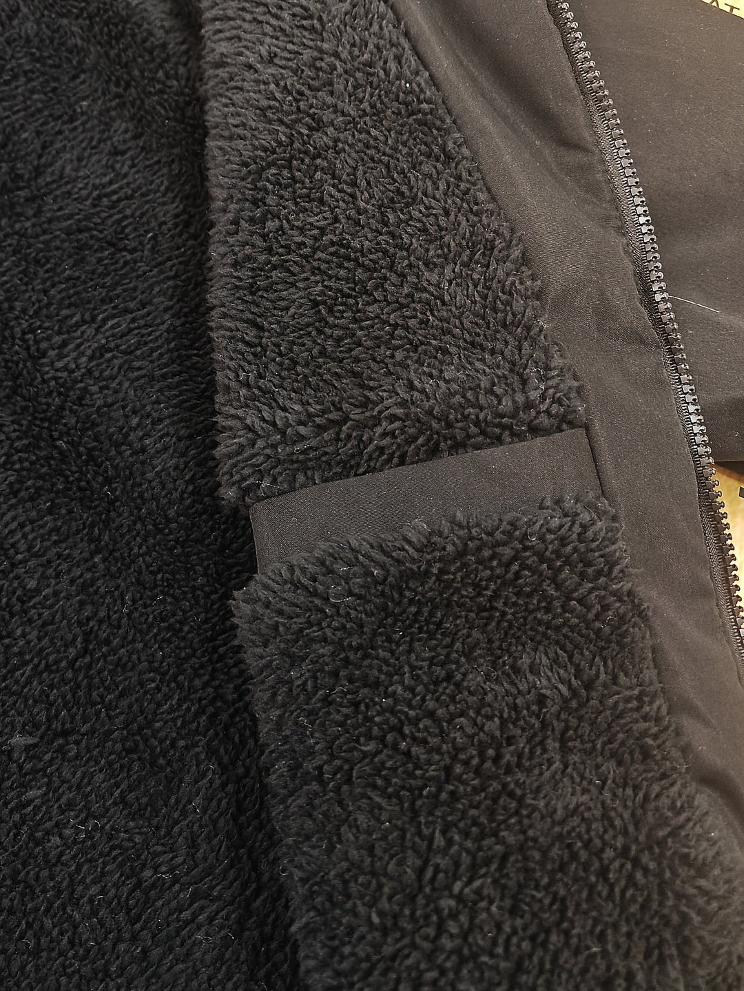 Warm lining visible inside a men's hooded coat