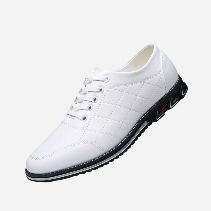 Close-up of the men's formal shoes with detailed stitching