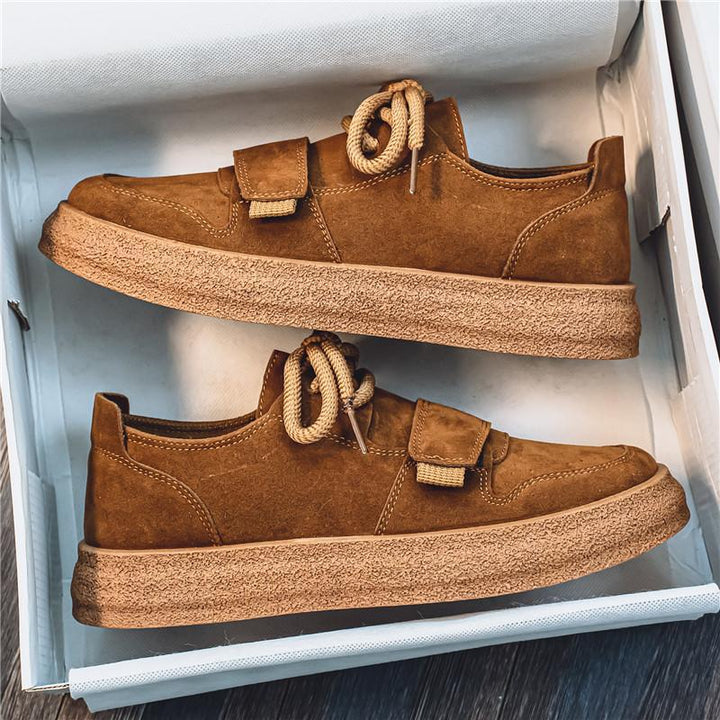 Men's suede trainers displayed from a three-quarter side perspective