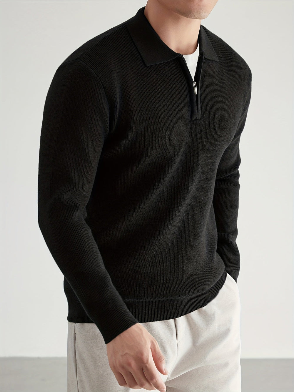 Men's knitted polo jumper showing the half zip collar