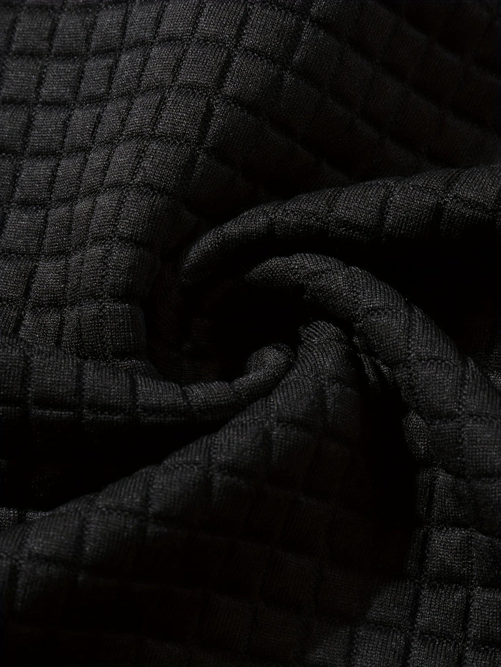 Men's hoodie sleeve showing the textured fabric and cuff