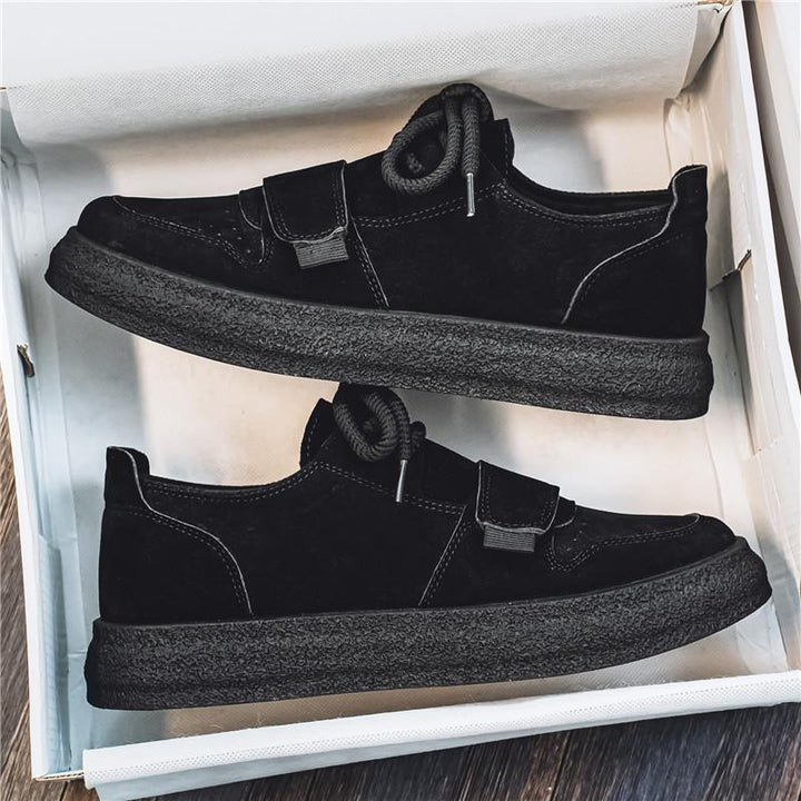 Detailed side profile of men's suede trainers with thick sole