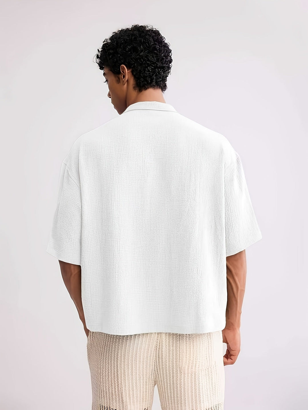 Men's casual camp collar shirt styled with trousers for a smart casual look