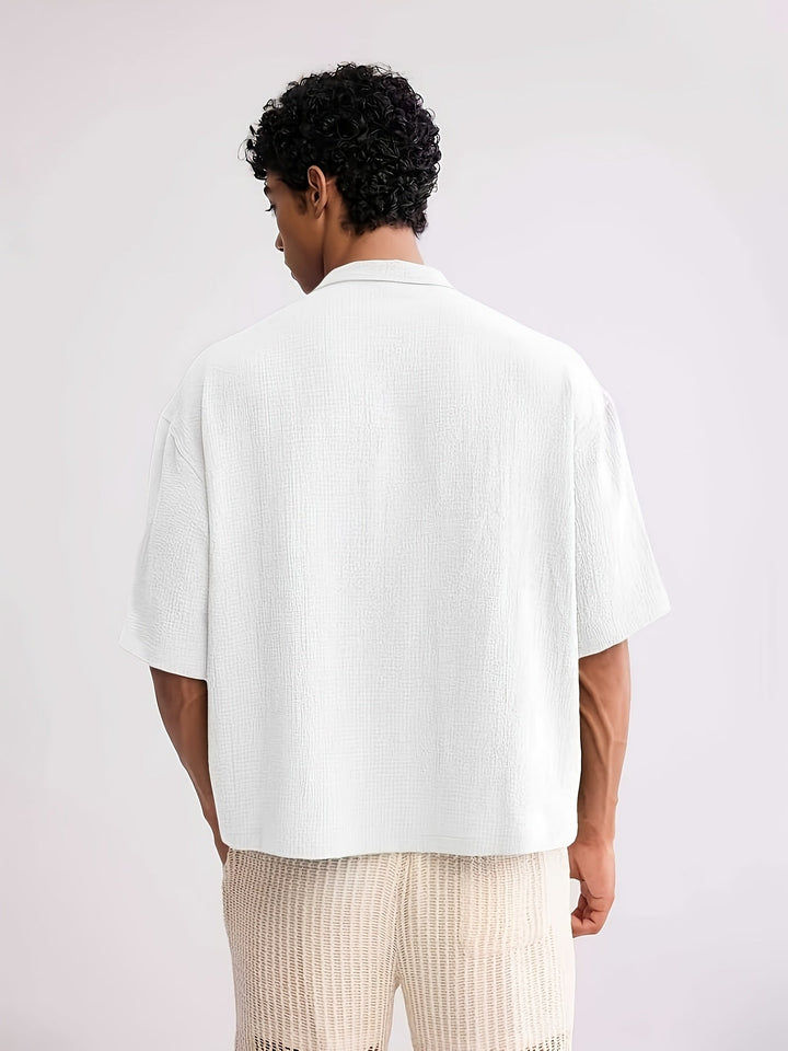 Men's casual camp collar shirt styled with trousers for a smart casual look