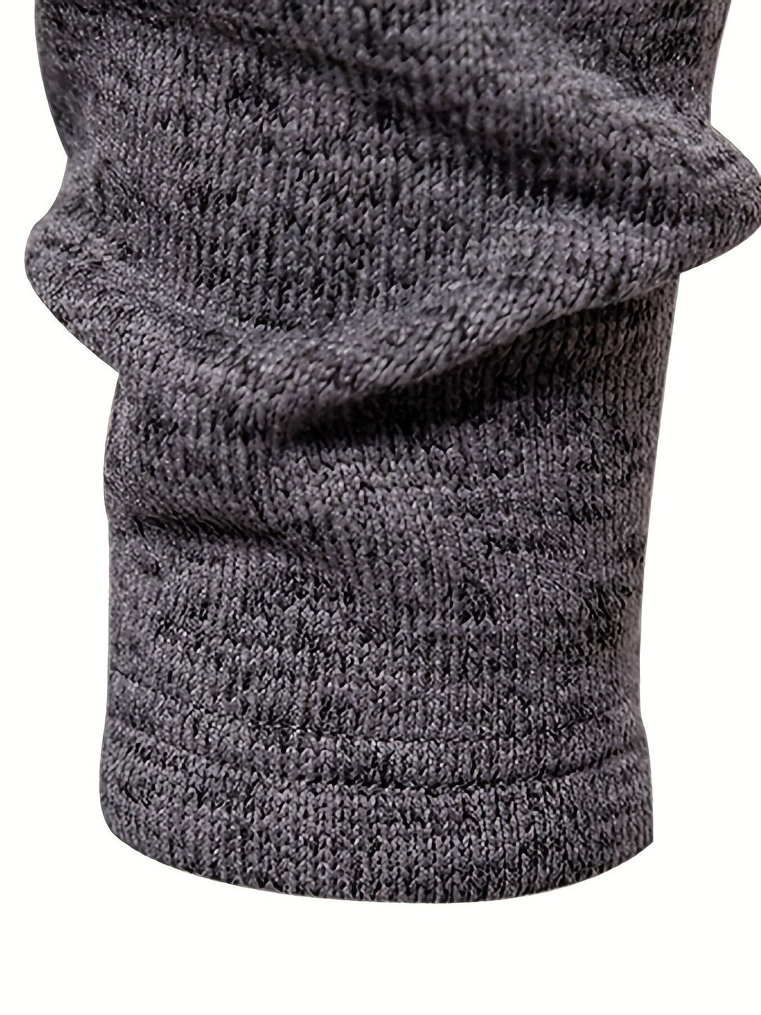 Side view showing the relaxed shape of the men's jumper