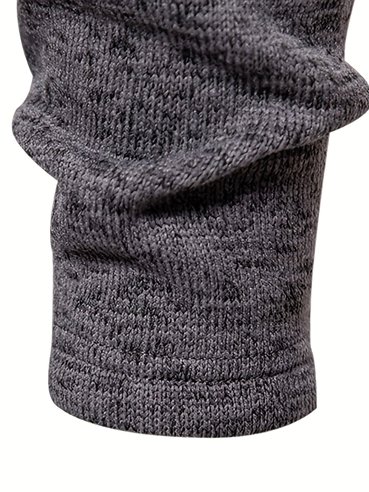 Side view showing the relaxed shape of the men's jumper