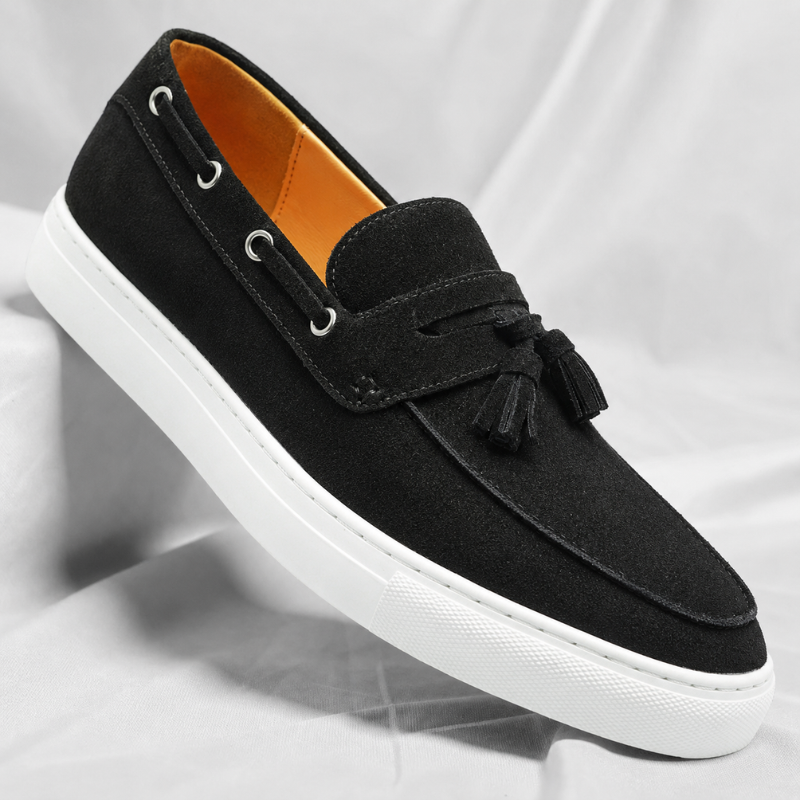 Men's suede tassel loafers outsole view showing sole texture and heel detail