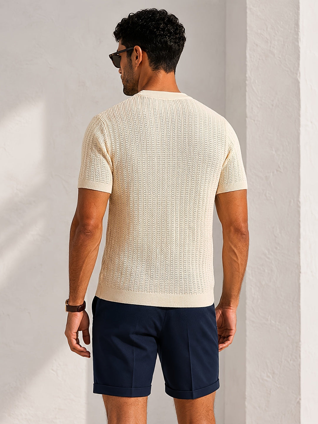 Men's short sleeve textured knit T-shirt styled with casual trousers