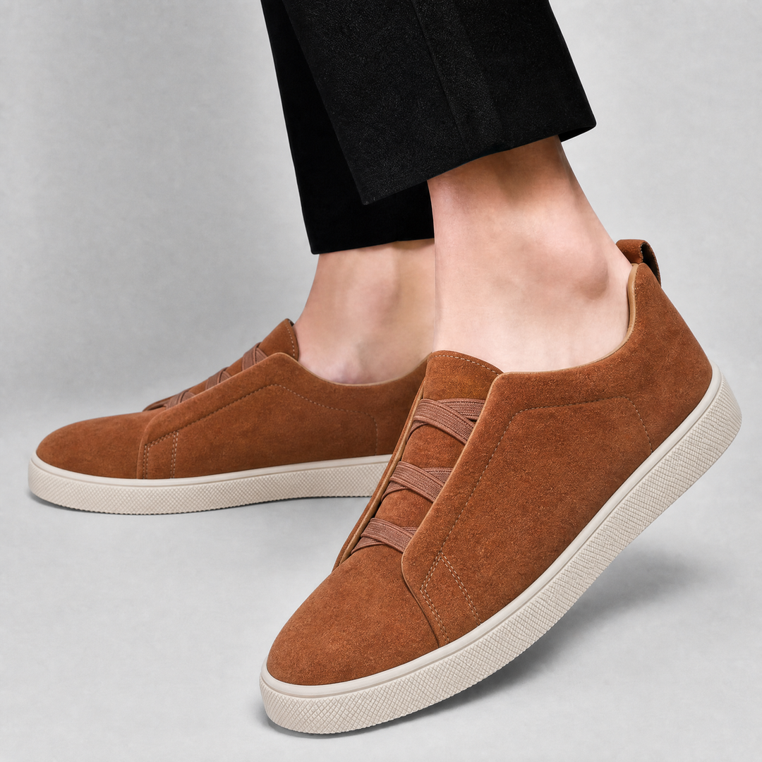 Men's suede sneaker pair displayed at a three-quarter angle