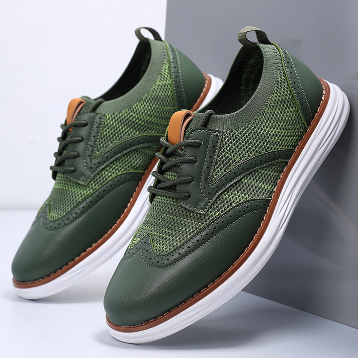 Men's mesh leather trainers in side profile showing breathable panel design