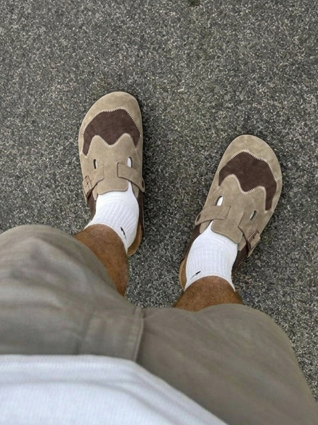 Top view of men's beige suede clogs showing the upper