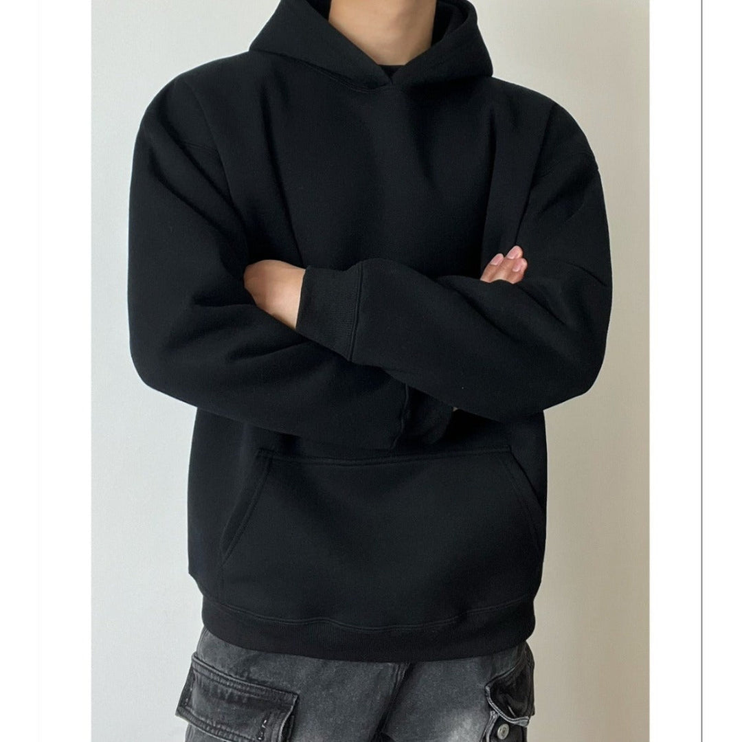 Side view of a men's relaxed fit hoodie with long sleeves