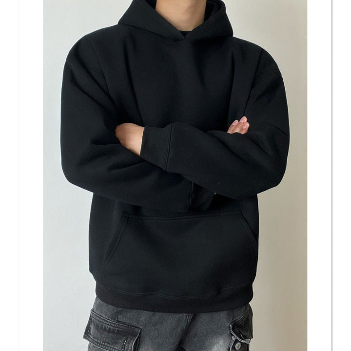 Side view of a men's relaxed fit hoodie with long sleeves