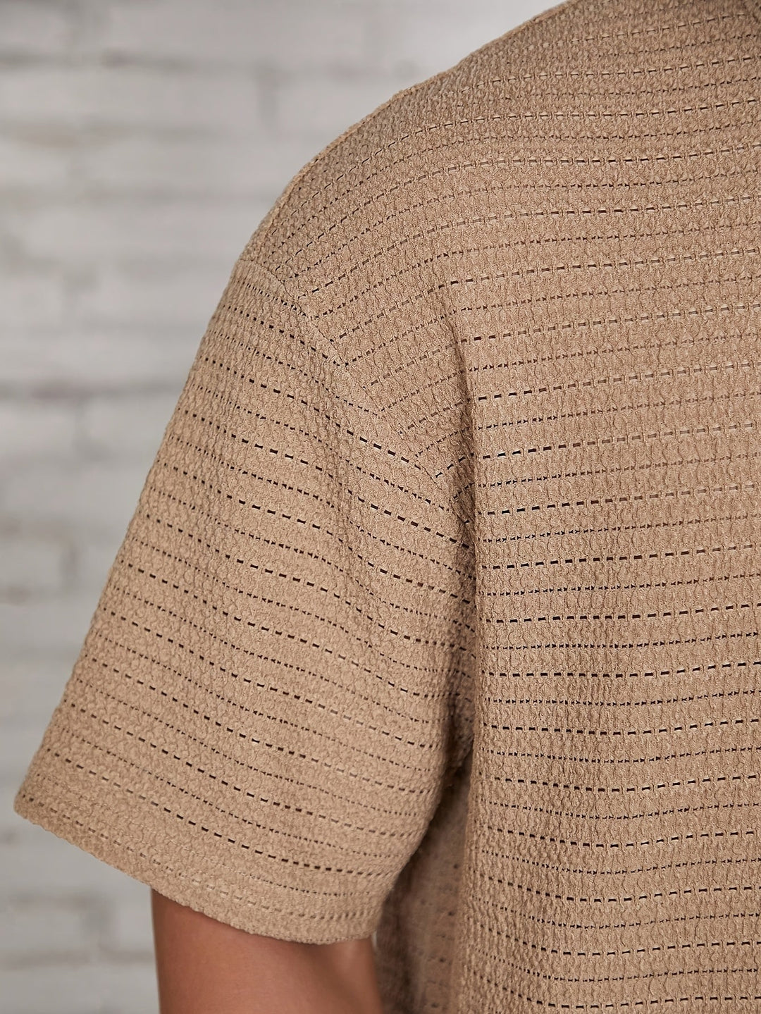 Close-up of waffle texture on the men's casual shirt