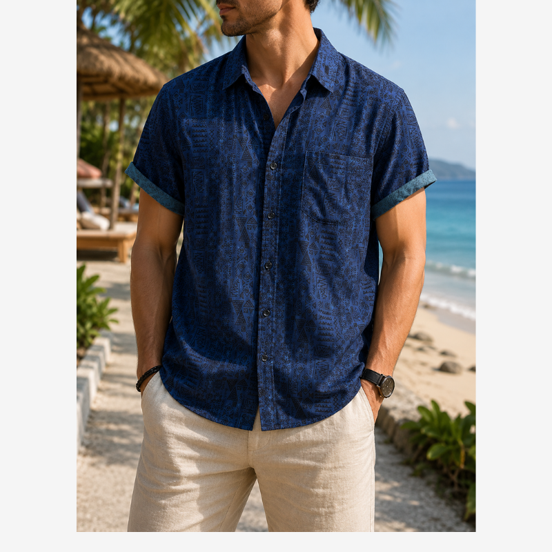 Men's patterned shirt with short sleeves and button-up front on a plain background