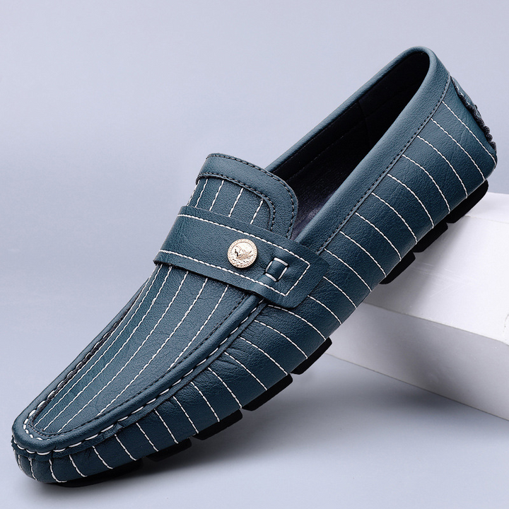 Men's leather loafers with metal detail shown from the front angle