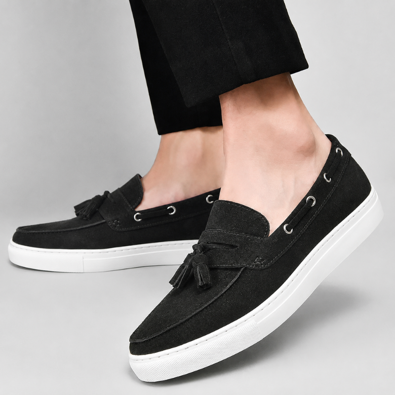 Men's suede tassel loafers heel view showing rear stitching and structured shape