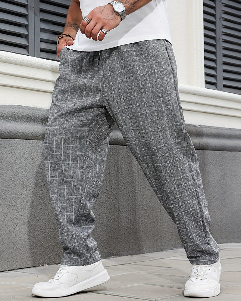 Men's straight leg plaid drawstring trousers shown from the back
