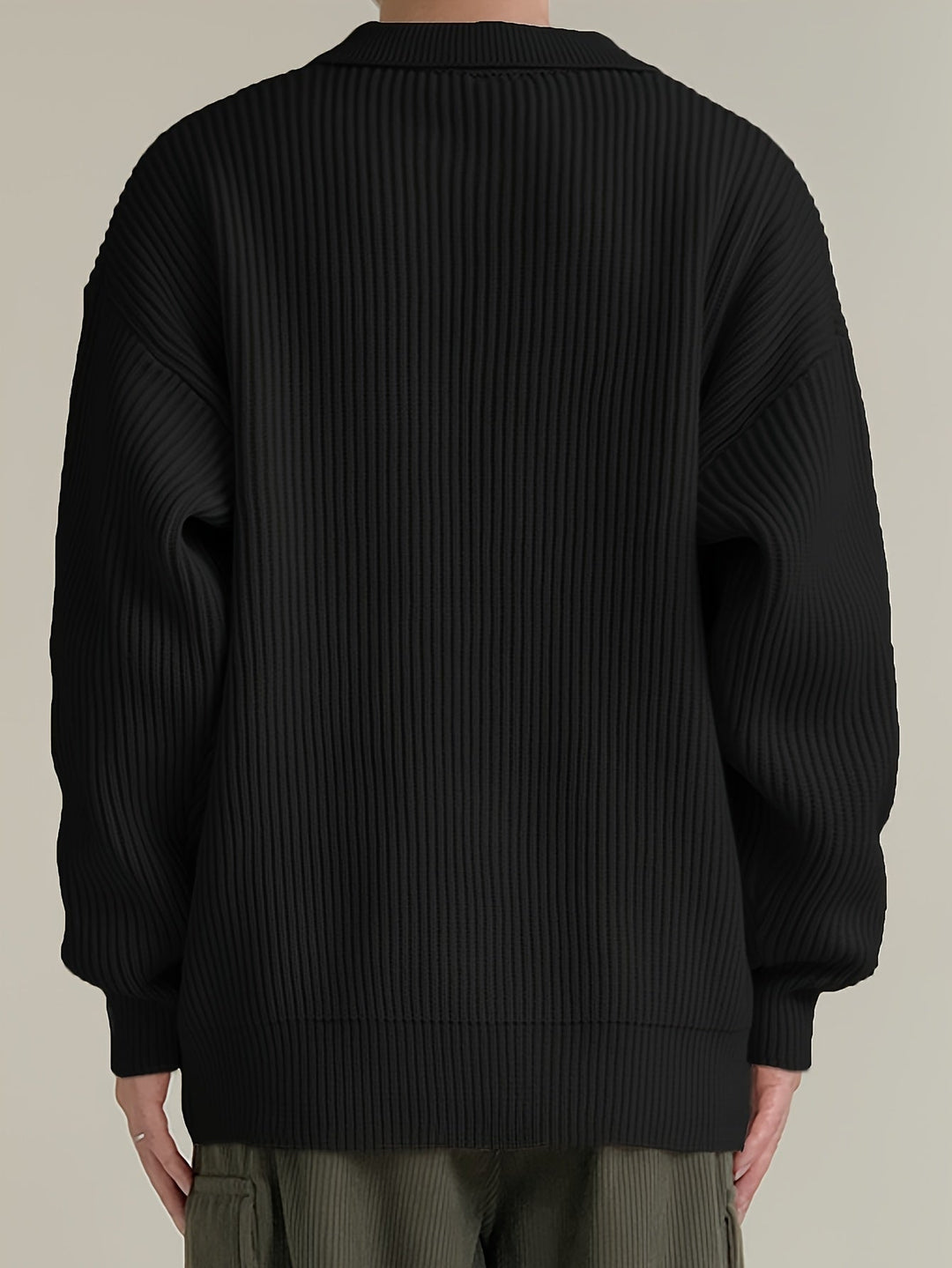 Front view highlighting the button placket of the cardigan
