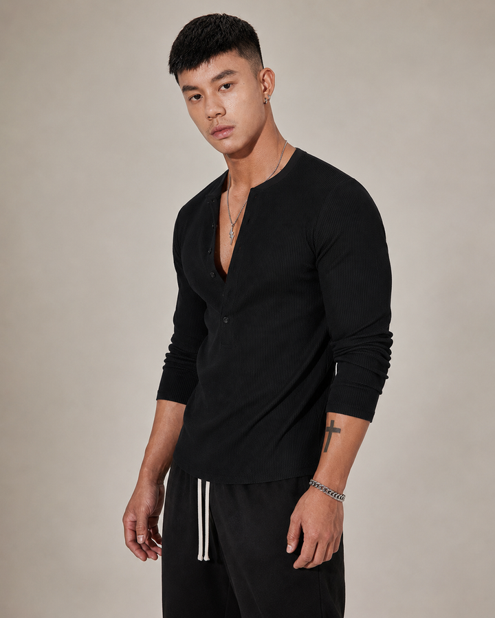 Side view of the ribbed knit half button jumper