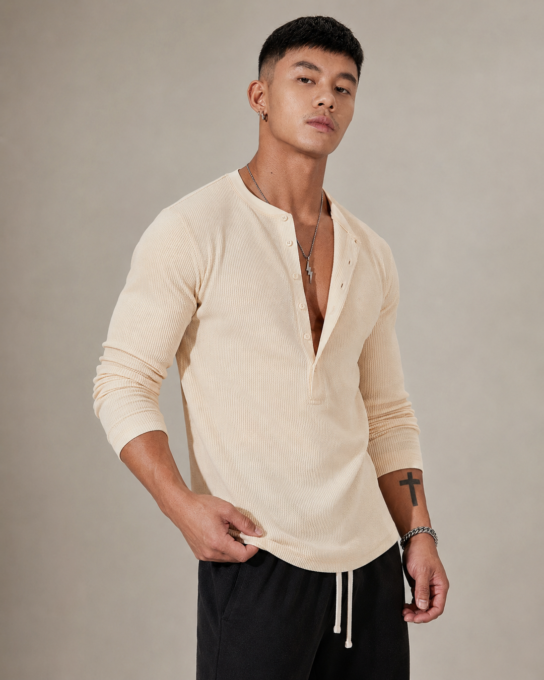 Close-up of the ribbed knit texture and half button neckline