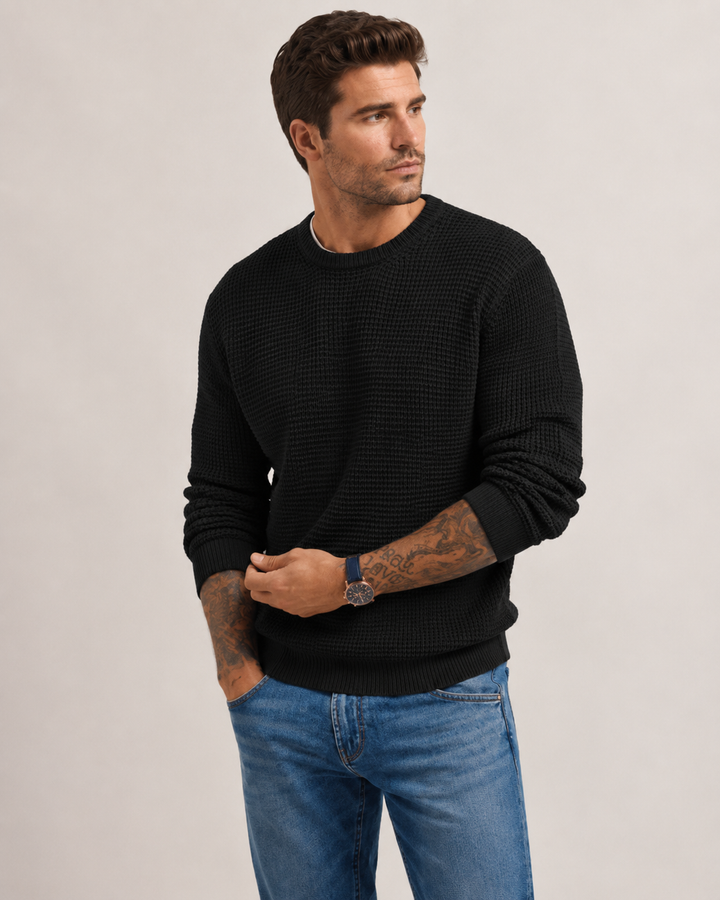 Detailed view of the cuffs on a men's structured knit pullover