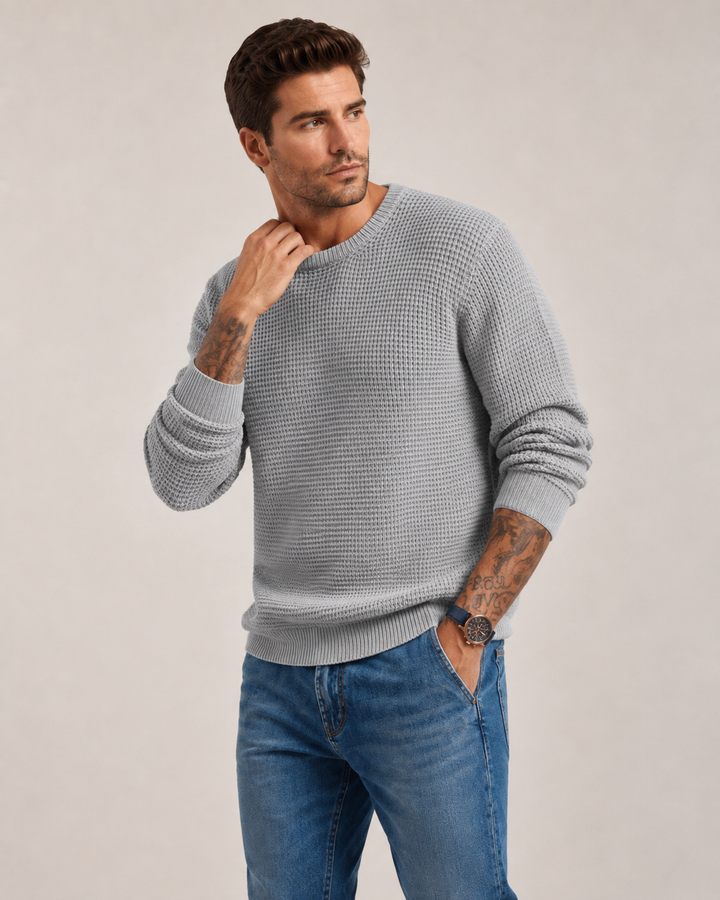 Close-up of the structured knit detail on a men's pullover