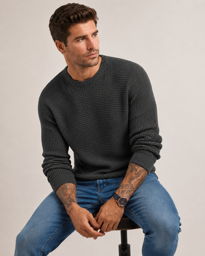 Side view of a men's structured knit pullover
