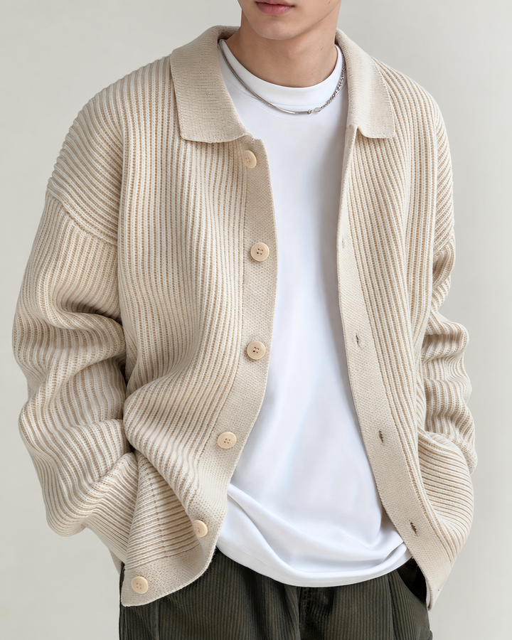 Close-up view of the cardigan's pointed collar and ribbed finish